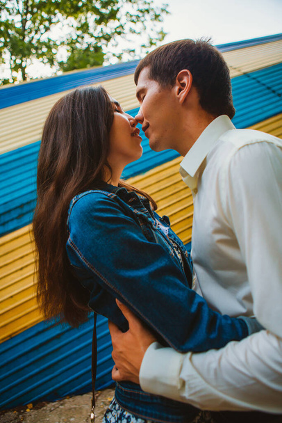 Beautiful young couple on the city background. - Фото, изображение