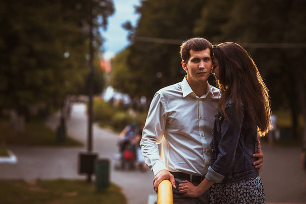 Beautiful young couple on the waterfront. - 写真・画像