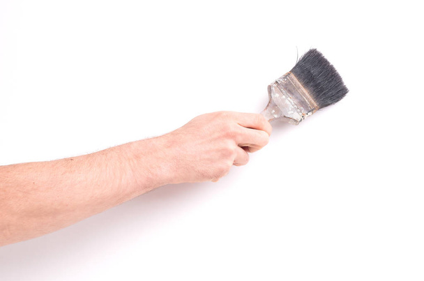 Man using old paint brush, on white background - 写真・画像
