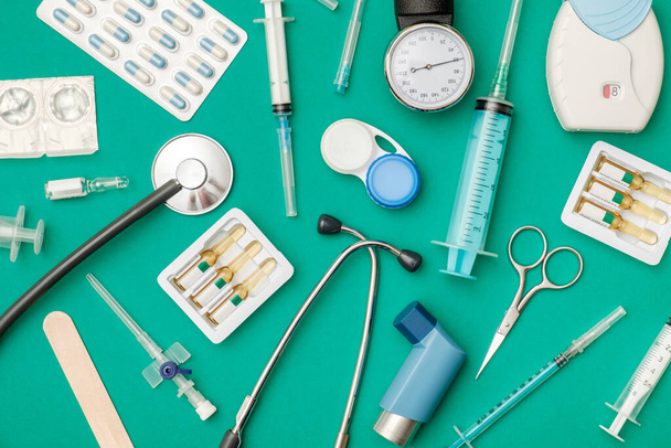 Top view of doctor's table with stethoscope and other equipment - Foto, Imagem