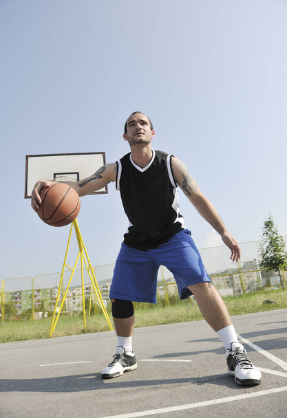 basketball player practicing and posing for basketball and sports athlete concept - Foto, Imagem
