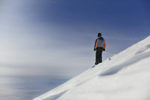 man ski free ride downhill at winter season on beautiful sunny day and powder snow - Fotoğraf, Görsel