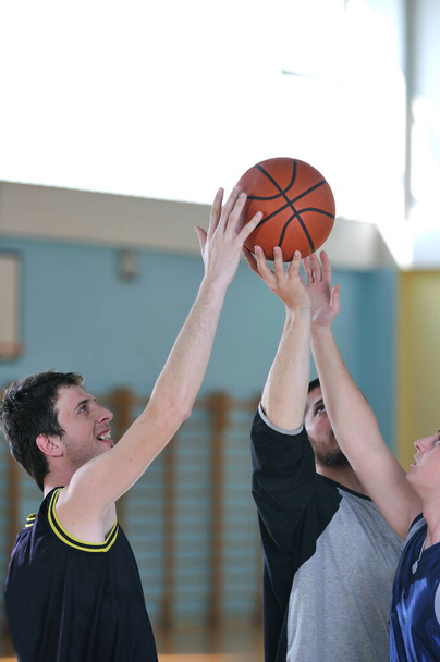 competition cencept with people who playing basketball in school gym  - Fotografie, Obrázek