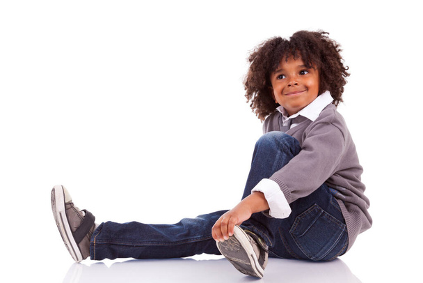 Portrait of a cute african american little boy, isolated on white background - 写真・画像