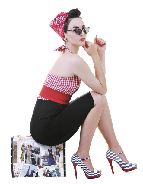 pretty young happy woman with travel bag waiting and posing isolated on white in studio - 写真・画像