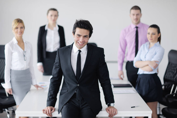 Confident young business man attending a meeting with his colleagues - 写真・画像