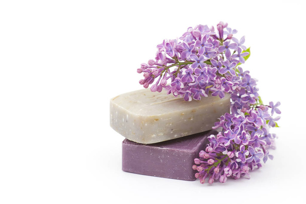 two bars of natural soap and lilac flowers isolated on white - Fotografie, Obrázek