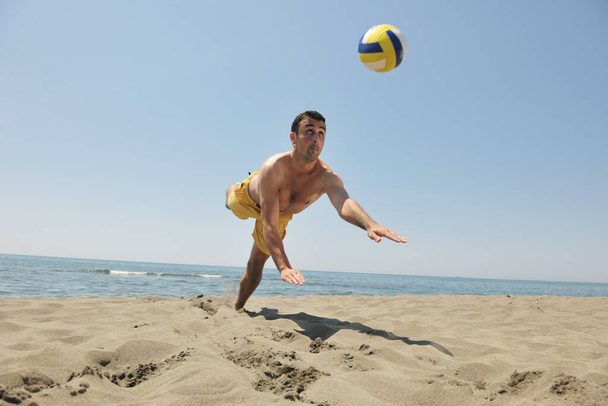 male beach volleyball game player jump on hot sand - Photo, Image