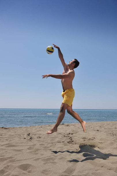 male beach volleyball game player jump on hot sand - Foto, Bild