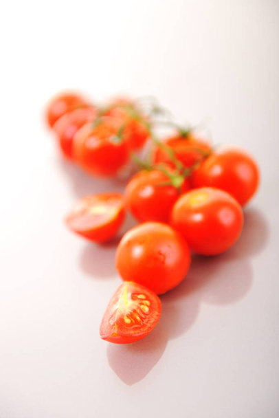 small wet fresh red tomato group isolated on white with glossy surface reflection - Fotoğraf, Görsel