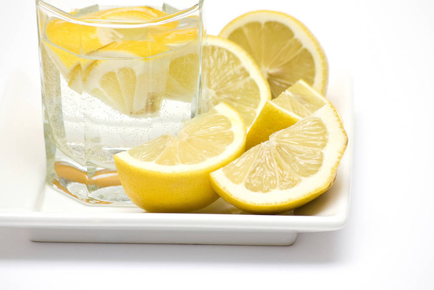 Glass of fresh water with lemon - Фото, зображення