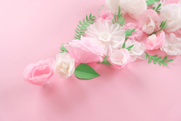 Hello, spring. With white and pink paper flowers and green leaves - Foto, afbeelding