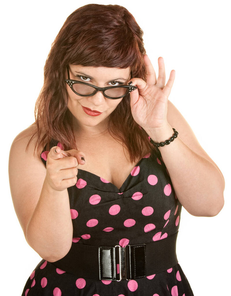 Pretty woman holding eyeglasses and pointing her finger - Photo, image