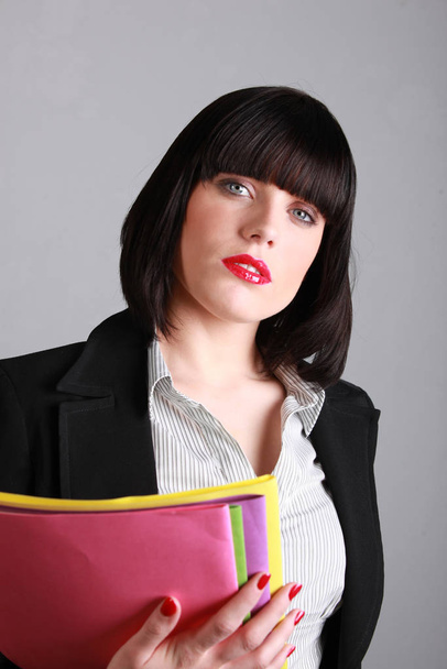 sexy businesswoman holding folders - Foto, immagini