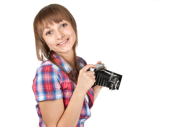 Young girl with old analog photo by camera on white background - Φωτογραφία, εικόνα