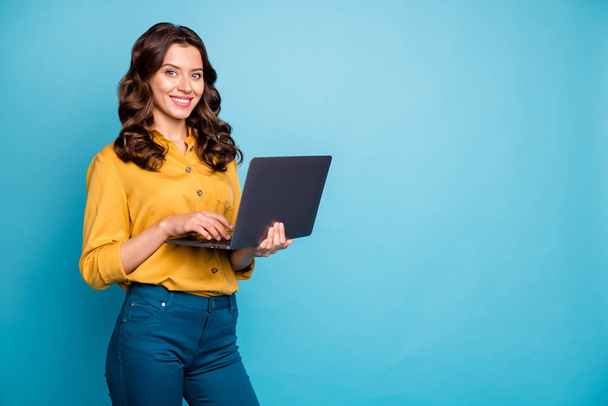 Portrait of her she nice attractive confident cheerful cheery wavy-haired girl holding in hands laptop creating web design isolated on bright vivid shine vibrant green blue turquoise color background - Fotografie, Obrázek