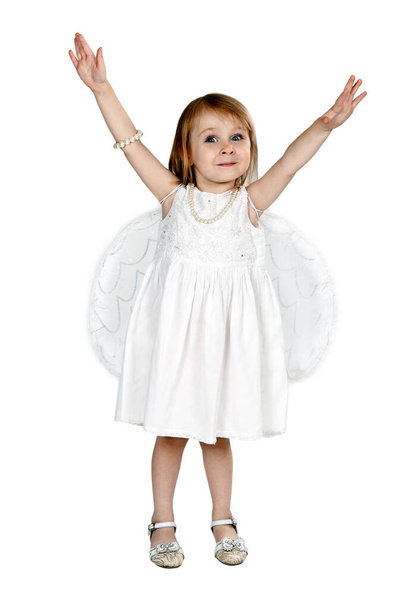 little girl with angel wings in the studio on a gray background - Foto, imagen