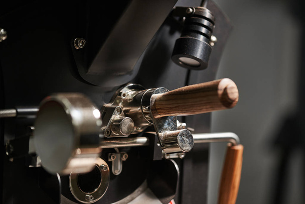 Coffee processing technology. Details of coffee roasting machine. Close-up. - Fotó, kép