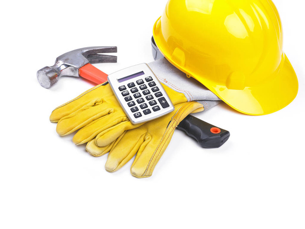 Ready fgor building site - HardHat Hammer Gloves Calculator on white - Foto, Imagen