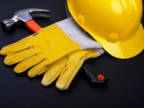HardHat Hammer And Gloves on black - Foto, Imagen