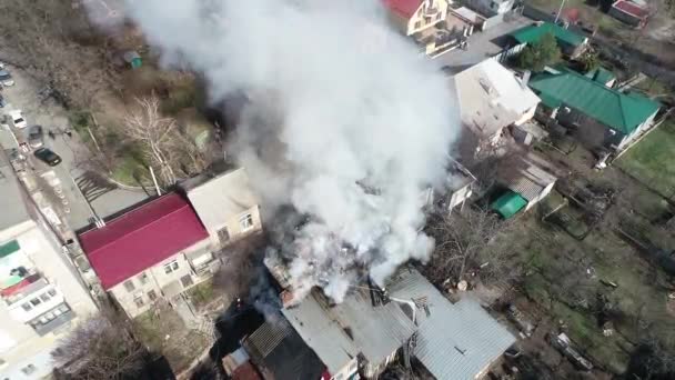 a house catches a fire with lots of smoke house burns a lot of smoke aerial panoramic top view from height copter drone flying sky - Footage, Video