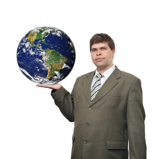 Businessman holding earth planet on palm - Foto, afbeelding