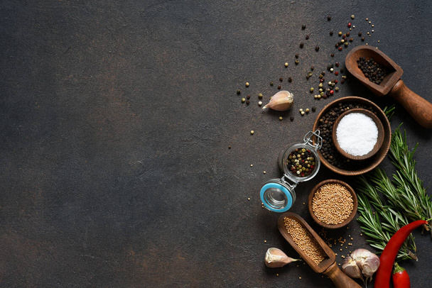 Various spices and herbs on a stone table. Top view  - 写真・画像