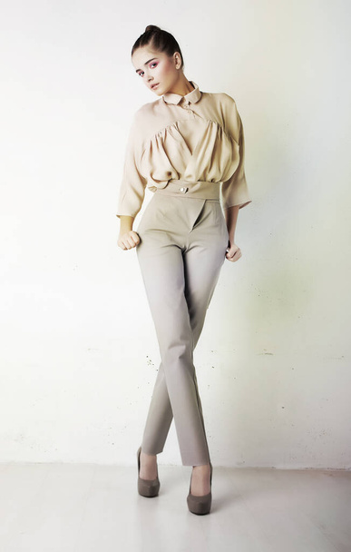 Perfect fashionable lady wearing white trousers and blouse - Foto, Imagem