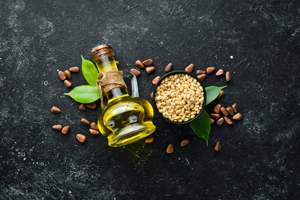 Pine nuts oil and pine nuts. Superfood. free space for your text. Top view. - Φωτογραφία, εικόνα