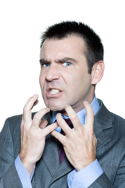 Closeup portrait of an expressive angry mature man in studio on isolated white background - Photo, image