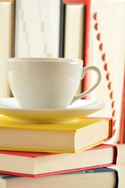 Composition with stack of books and cup of coffee - Foto, immagini