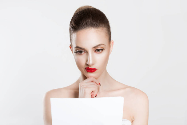 New contract concept. Beauty girl woman actress white shirt looking skeptical analyzing papers contract documents isolated white grey background wall. Full makeup Red lips false eyelashes clean skin - Photo, image