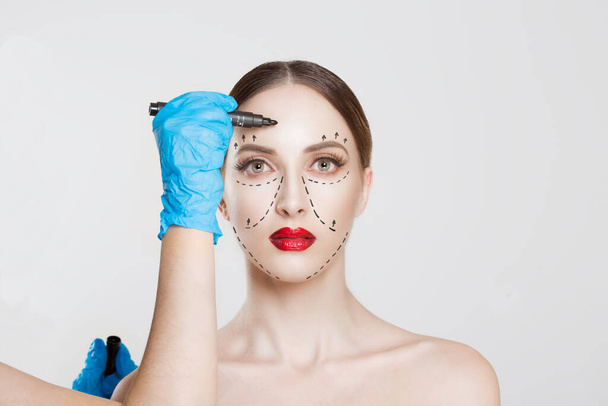 Facial cosmetic plastic surgery. Doctor surgeon hand in glove dr - Photo, image