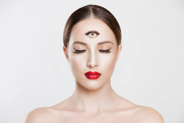 Psychic. Woman with 3 third eye looking at you camera concentrating thinking with mind and heart intuition about problem isolated white grey background. Making smart decision find solution concept - Foto, afbeelding