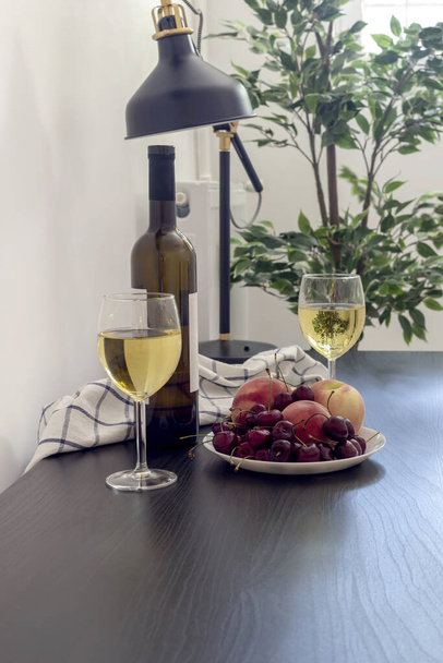 Table with fruit and wine on the room close-up - Photo, Image
