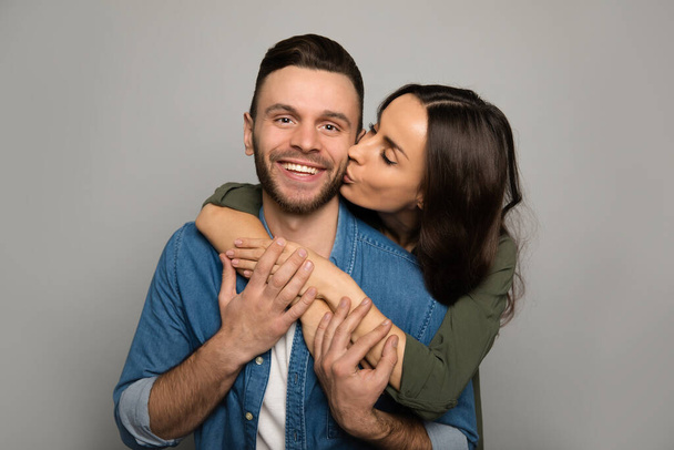 happy couple  kissing on studio background  - Photo, Image