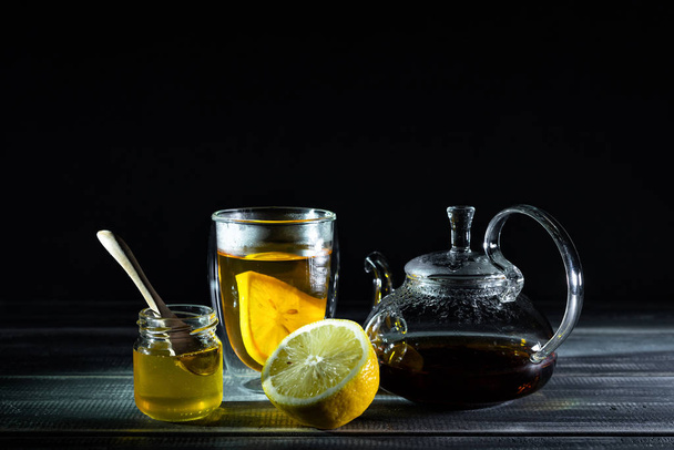 lemon, black tea, honey. Tea party. Teapot.  - Zdjęcie, obraz