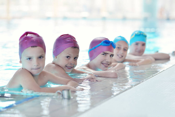 happy children kids group  at swimming pool class  learning to swim - Fotoğraf, Görsel