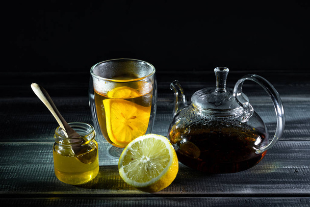 lemon, black tea, honey. Tea party. Teapot.  - Fotografie, Obrázek