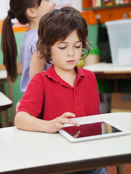 Little Boy Using Digital Tablet In Kindergarten - Foto, Bild