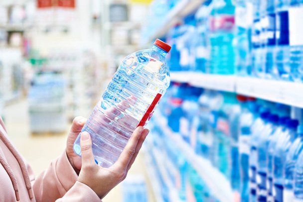 Plastic bottle drinking water in store - Фото, зображення