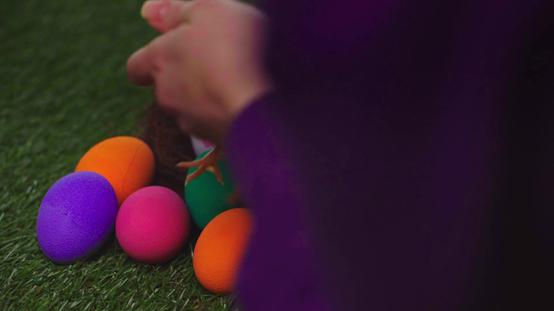 cropped view of woman near chickens and easter eggs  - Footage, Video