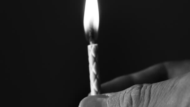 Birthday candle extreme close up, extreme macro. Dark background. - Filmagem, Vídeo