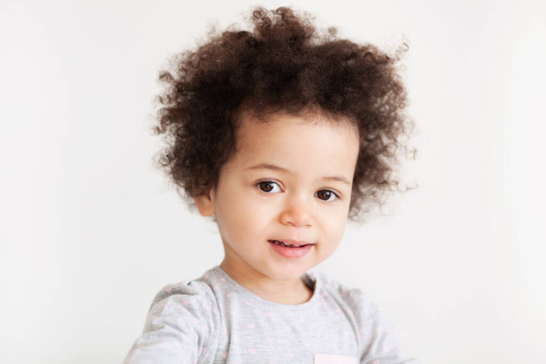 Cute funny little girl with curly hair - Fotoğraf, Görsel