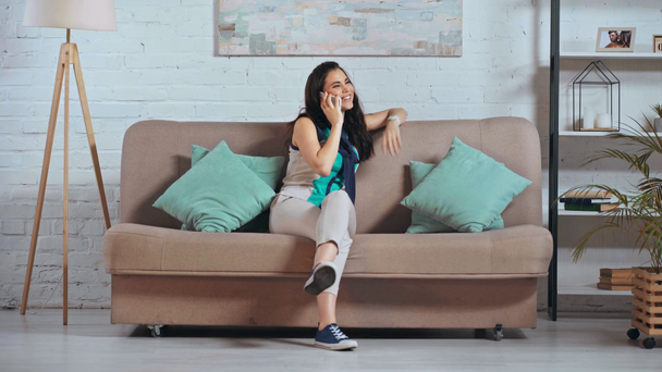 happy woman talking on smartphone at home - Metraje, vídeo
