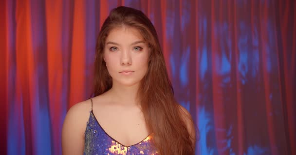 Beautiful young caucasian girl glitter palette girl neon light background portrait - Metraje, vídeo