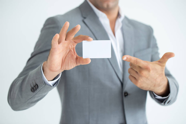 Businessman's hand showing business card - close up shot on white background. - Zdjęcie, obraz