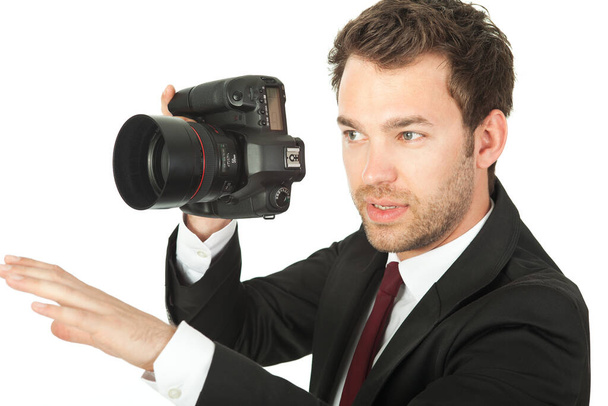 young man with camera isolated on white - Φωτογραφία, εικόνα