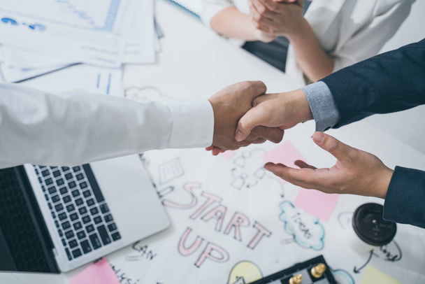 Start up and Successful Concept.Business people handshake of happy business people after contract agreement to become a partner,Finishing up a meeting,collaborative teamwork. - Photo, Image