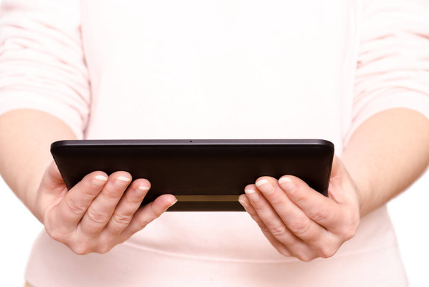 two hands of a woman holding a tablet computer - Photo, Image